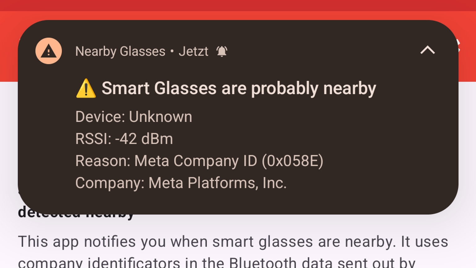 Unbranded camera-equipped smart glasses beside a face-down smartphone on a café table